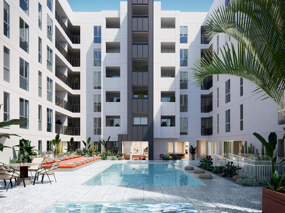 Westlake, CA Apartments - Wilco Apartments Pool and Spa with Lush Landscaping, Lounge Chairs, and Table Seating